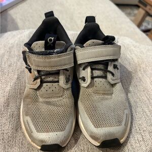 On cloud, blue tennis shoes